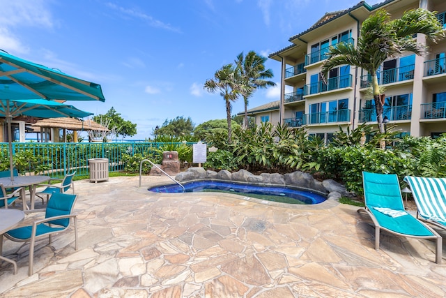 view of swimming pool with a patio