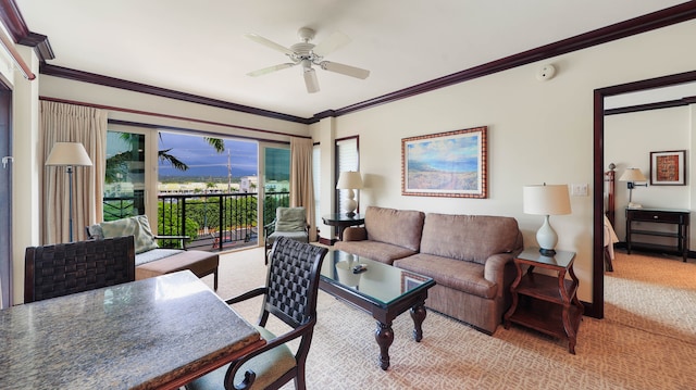 living room featuring ornamental molding, light colored carpet, and ceiling fan