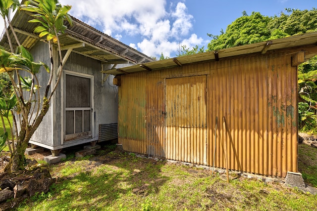 view of side of home with an outdoor structure