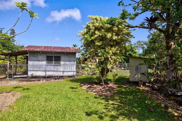 view of yard featuring a storage unit