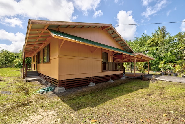 view of home's exterior featuring a yard