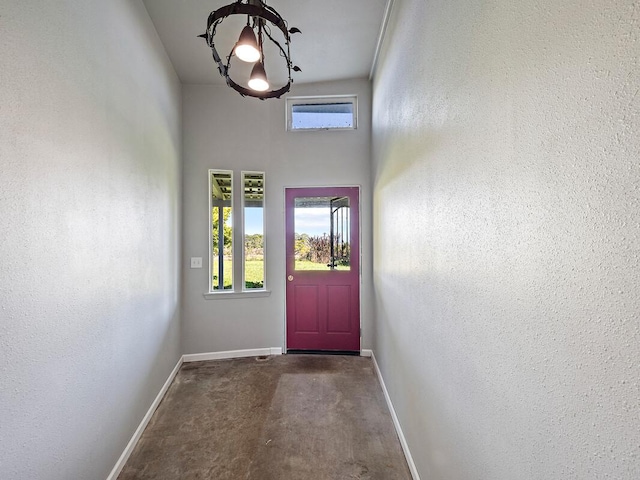 doorway featuring carpet and vaulted ceiling