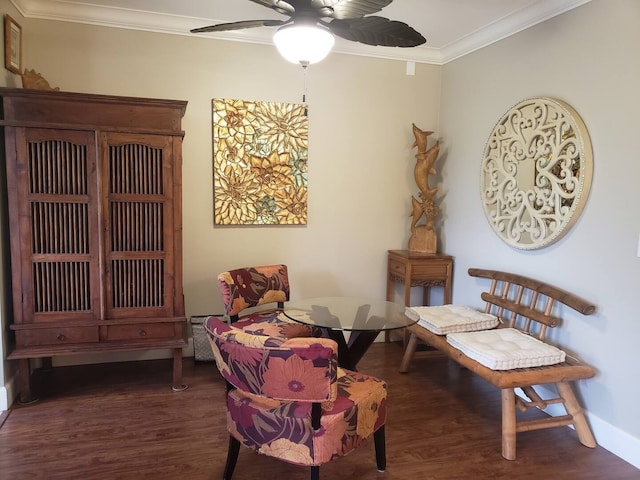 sitting room with ornamental molding, ceiling fan, and dark hardwood / wood-style floors