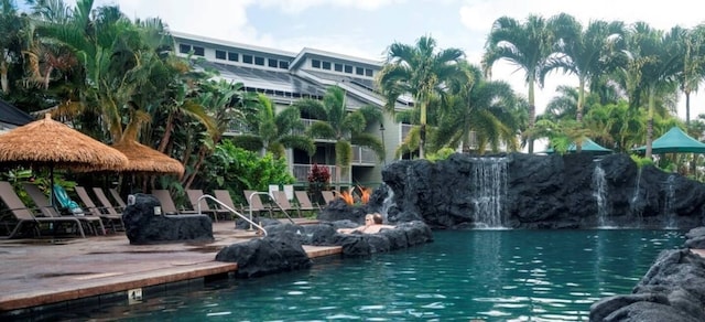 view of swimming pool with a water view