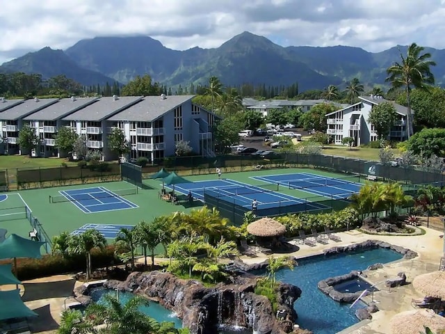 view of sport court with a mountain view and tennis court