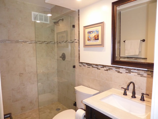 3811 Edward Rd Unit 1202, Princeville, HI 96722 - full bathroom with a walk in shower, vanity, tile walls, and toilet