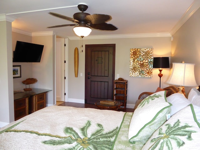 bedroom with ceiling fan and crown molding