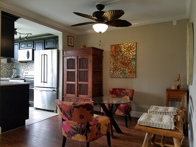 3811 Edward Rd Unit 1202, Princeville, HI 96722 - dining space with light wood-style floors, ornamental molding, and a ceiling fan