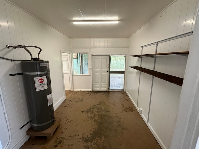 basement with water heater and wood walls