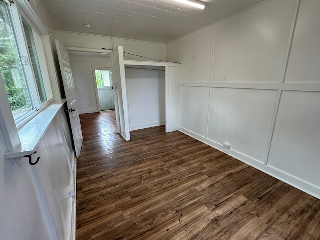 unfurnished bedroom with dark hardwood / wood-style floors