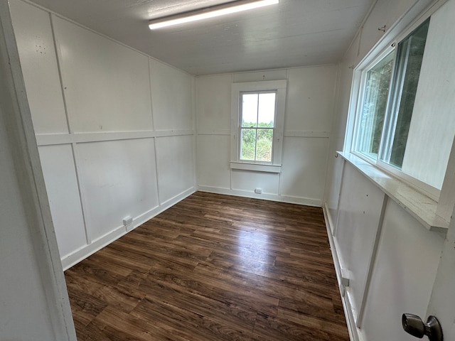 spare room with dark hardwood / wood-style flooring