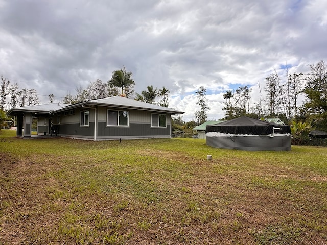 exterior space with a yard