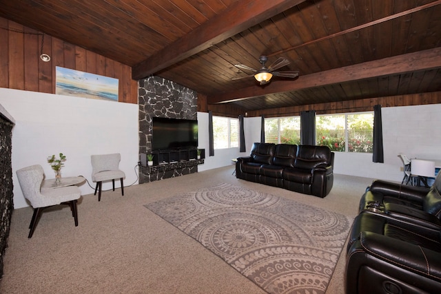 carpeted living room with vaulted ceiling with beams, wooden ceiling, and ceiling fan