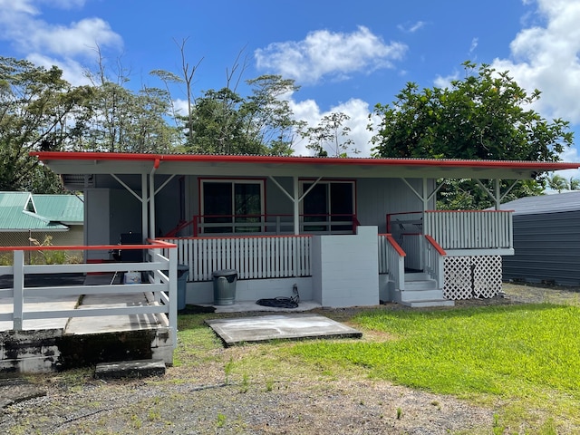 back of house featuring covered porch