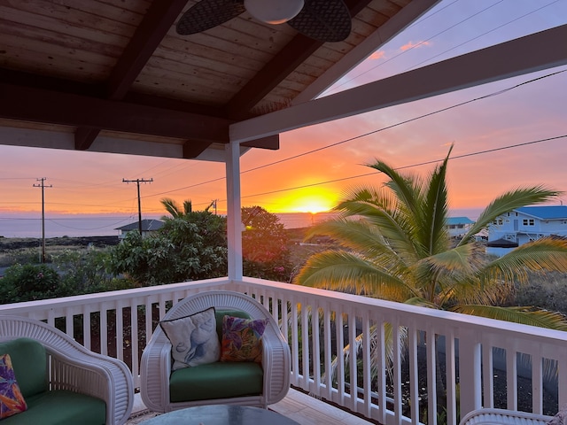 deck at dusk with ceiling fan