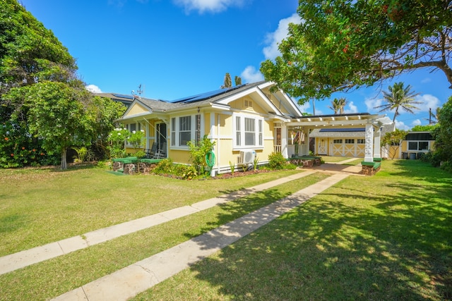 view of front of property featuring a front yard and a garage