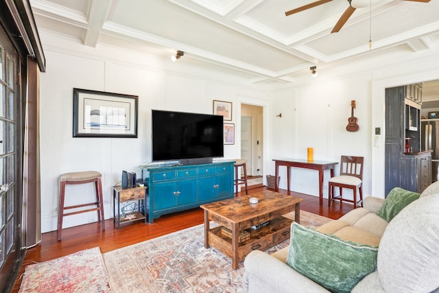 living room featuring crown molding, beam ceiling, and dark hardwood / wood-style flooring