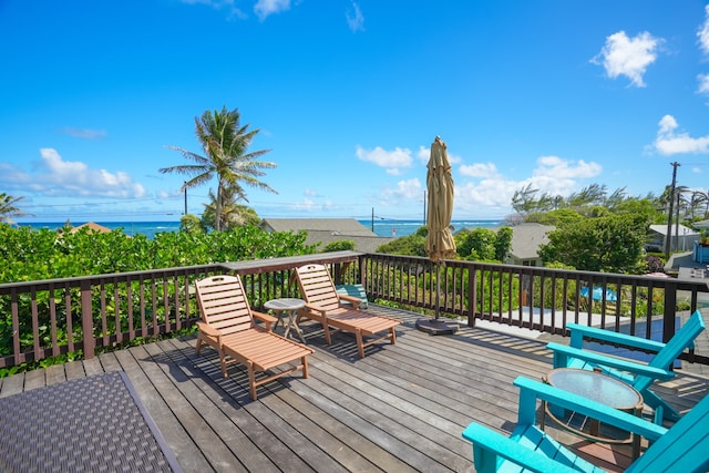 wooden deck with a water view