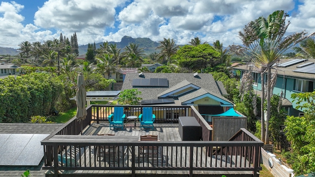 back of house featuring a deck with mountain view