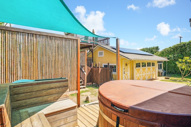 deck featuring a hot tub