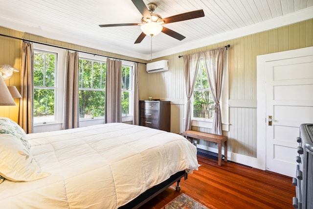 bedroom with dark hardwood / wood-style floors, an AC wall unit, crown molding, ceiling fan, and wood walls