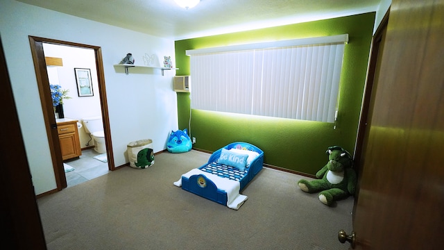 interior space featuring vanity, a wall unit AC, and toilet