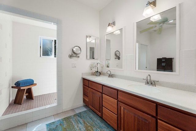 bathroom featuring a shower, vanity, tile patterned floors, and ceiling fan