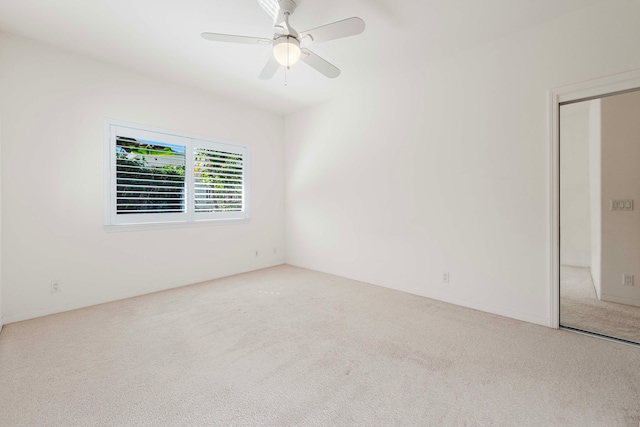 unfurnished room with carpet flooring and ceiling fan