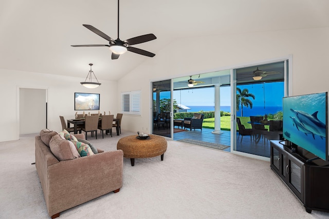 carpeted living room featuring ceiling fan and lofted ceiling