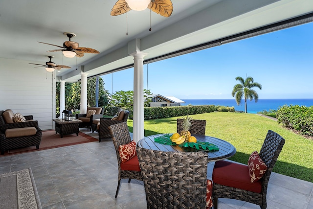 view of patio / terrace with outdoor lounge area, a water view, and ceiling fan