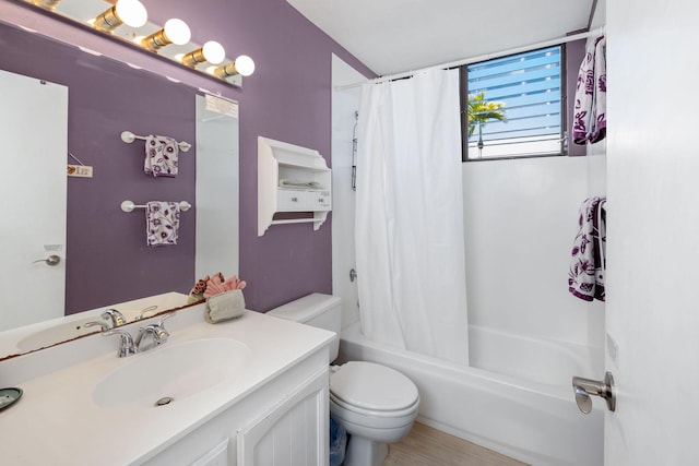 full bathroom with vanity, toilet, and shower / bath combo