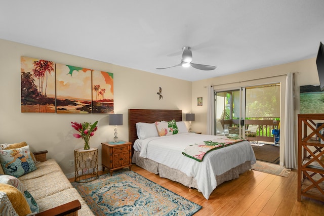 bedroom with access to outside, hardwood / wood-style flooring, and ceiling fan