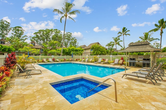 view of swimming pool featuring a patio, a hot tub, grilling area, and a gazebo