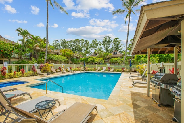 view of swimming pool featuring a patio