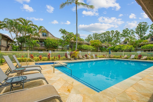 view of swimming pool with a patio area