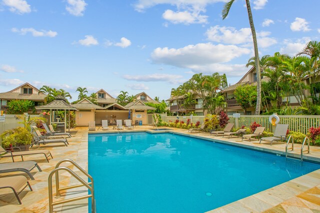 view of swimming pool featuring a patio and a gazebo