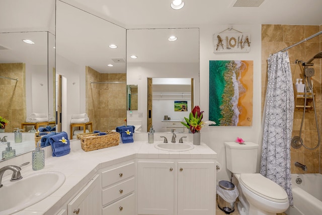 full bathroom featuring vanity, toilet, and shower / tub combo