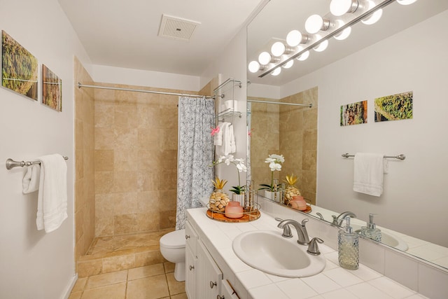 bathroom with toilet, walk in shower, vanity, and tile patterned flooring