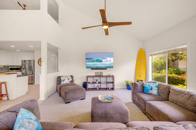 living room with light colored carpet, high vaulted ceiling, and ceiling fan