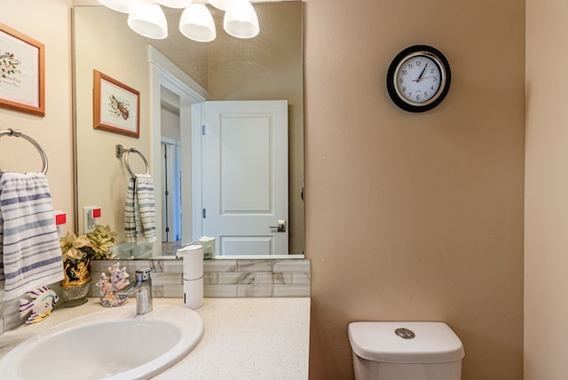 bathroom featuring toilet and sink