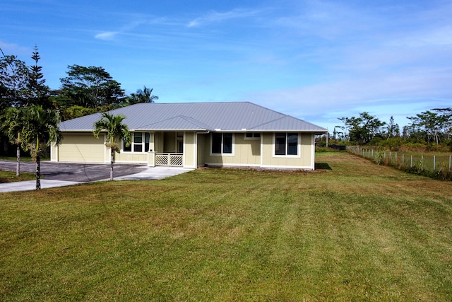 ranch-style home featuring a front lawn, a garage, and a porch