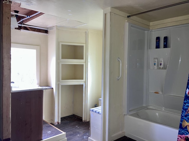 bathroom featuring hardwood / wood-style floors and shower / bath combo