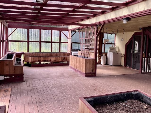 sunroom / solarium featuring washer / clothes dryer