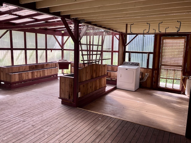 unfurnished sunroom featuring washer / dryer