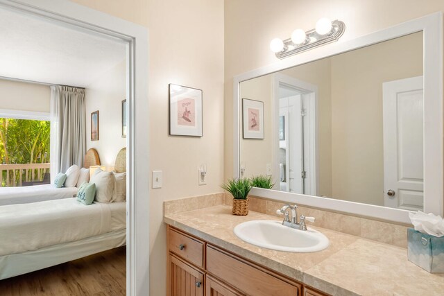 bathroom with vanity and hardwood / wood-style floors