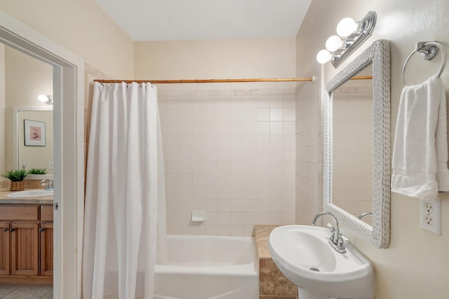 bathroom featuring tile patterned flooring, sink, and shower / tub combo