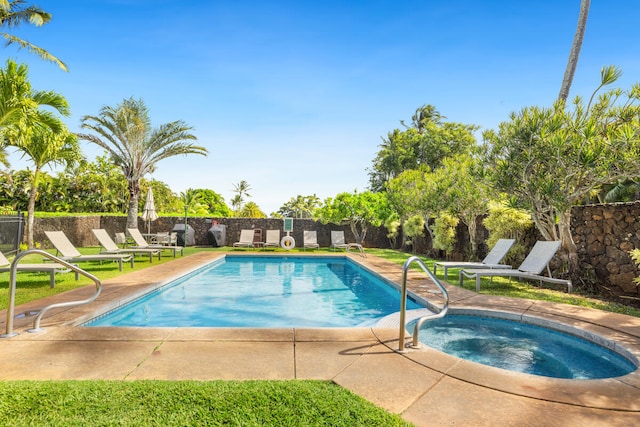 view of swimming pool with a community hot tub and a patio area