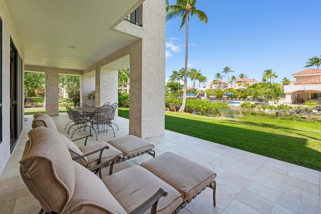 view of patio featuring a water view