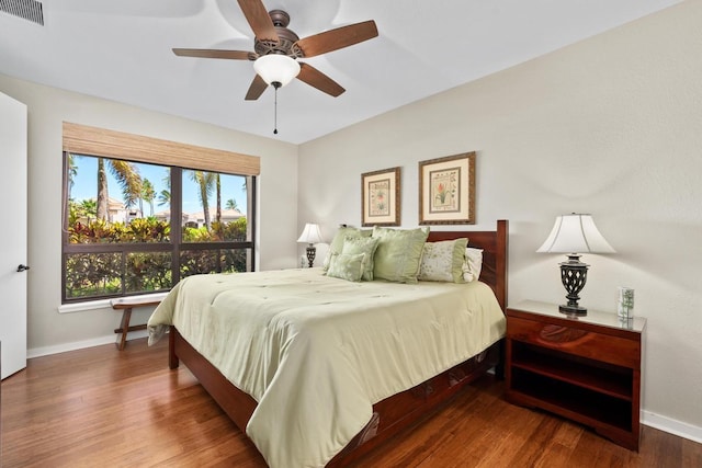 69-1035 Keana Pl Unit 113, Waikoloa, HI 96738 - bedroom with baseboards, wood finished floors, and a ceiling fan