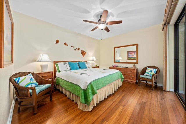 bedroom with hardwood / wood-style floors and ceiling fan